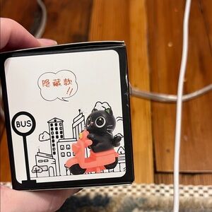 Black Cat Figurine on Pink Scooter